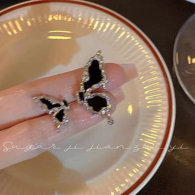 Damen Ring mit stilvollem Schmetterlings-Design und funkelnden Elementen Shop Nory