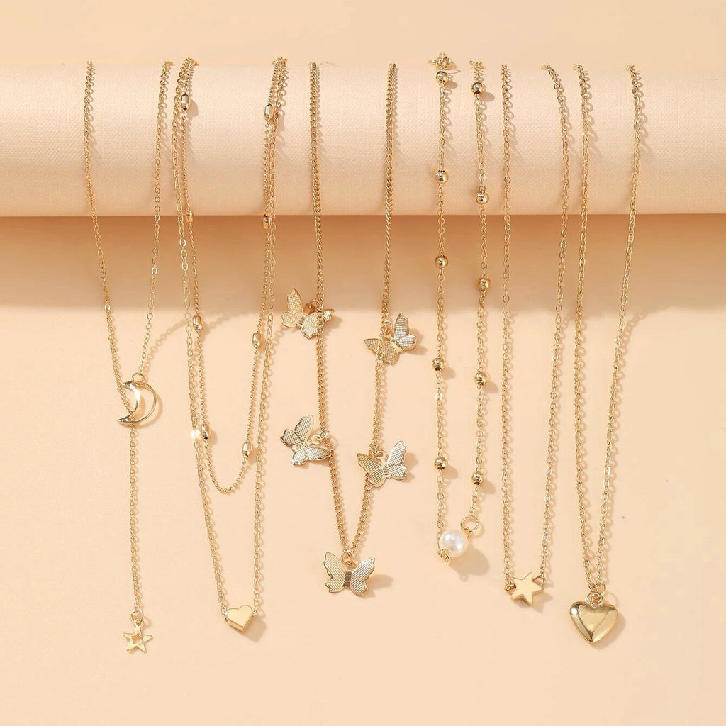 Damen Schmuckset mit mehrlagigen Ketten und vielfältigen Ringen Shop Nory