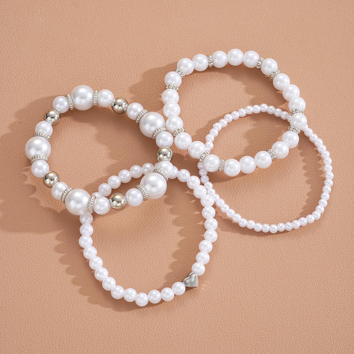 Damen Schmuckarmband-Set mit eleganten Perlen und silbernen Akzenten Shop Nory
