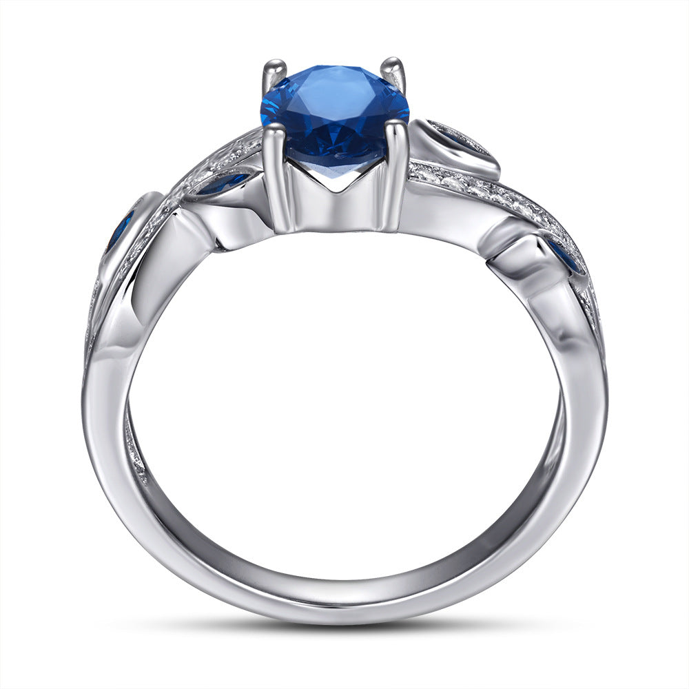 Damenring mit elegantem, geschwungenem Design und funkelnden Zirkoniasteinen Shop Nory