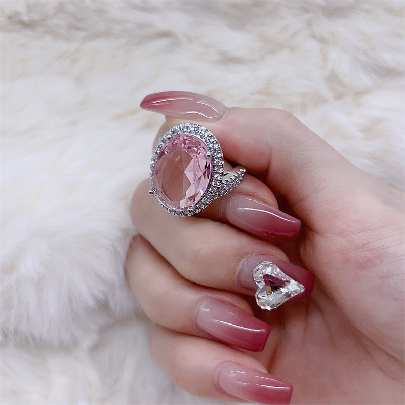 Damen eleganter Schmuckring mit ovalem Stein und funkelndem Zirkonia-Besatz Shop Nory