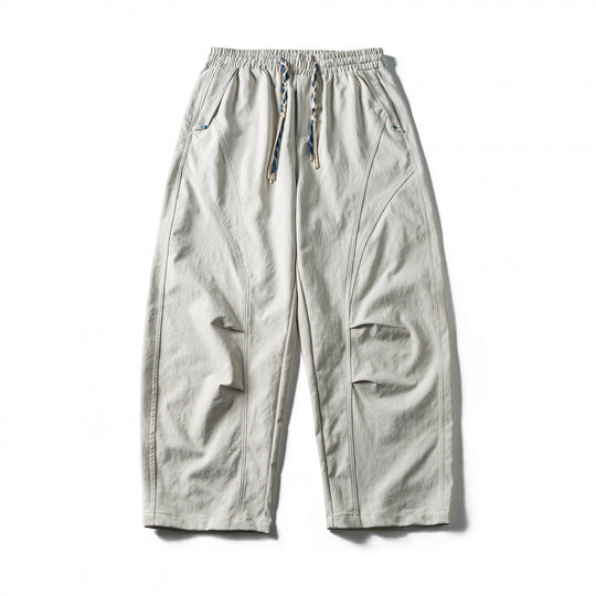 Unisex Weite Cropped-Hose mit Tunnelzug, elastischem Bund und markanten Nahtpaneelen Shop Nory