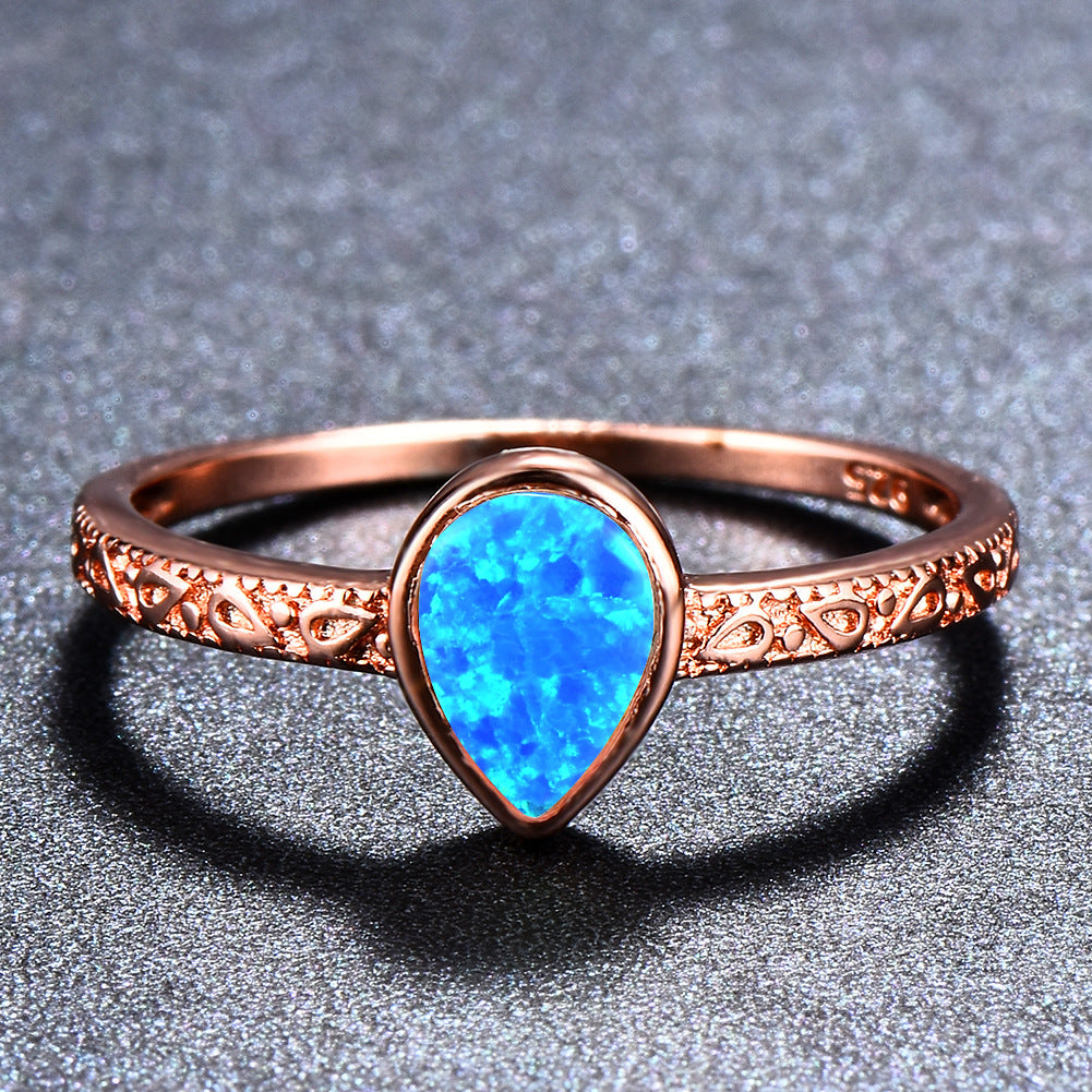 Damen Ring mit tropfenförmigem Opal und filigraner Zirkonia-Verzierung Shop Nory