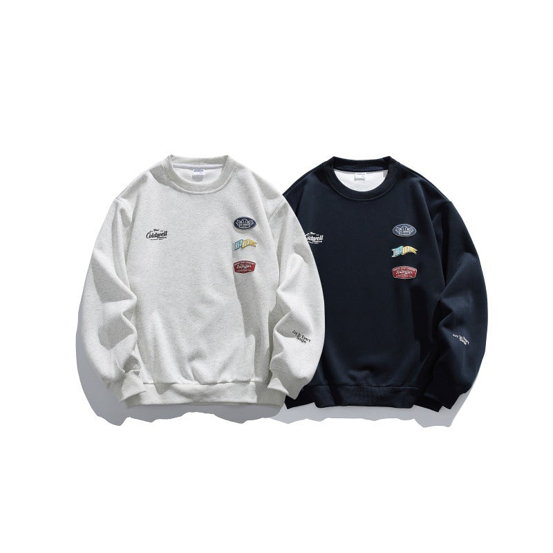 Unisex Oversize-Pullover mit Rundhalsausschnitt, Badge-Applikationen und gerippten Bündchen Shop Nory