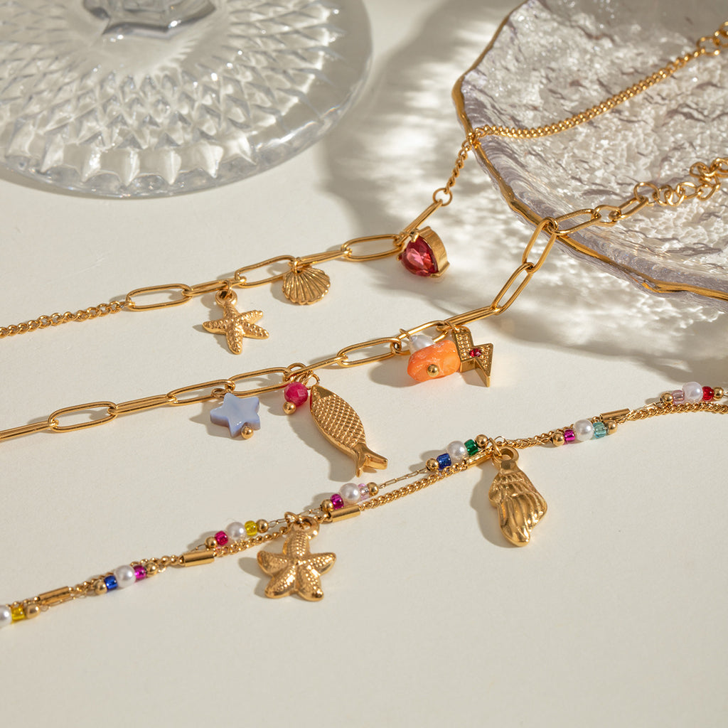 Damen Armband mit bunten Perlen und funkelndem Sternenanhänger Shop Nory