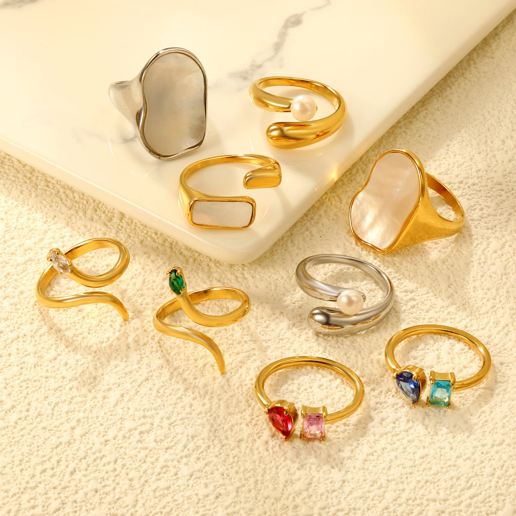 Damen Ring mit elegantem, geschwungenen Design und verstellbarem Perlenanhänger Shop Nory