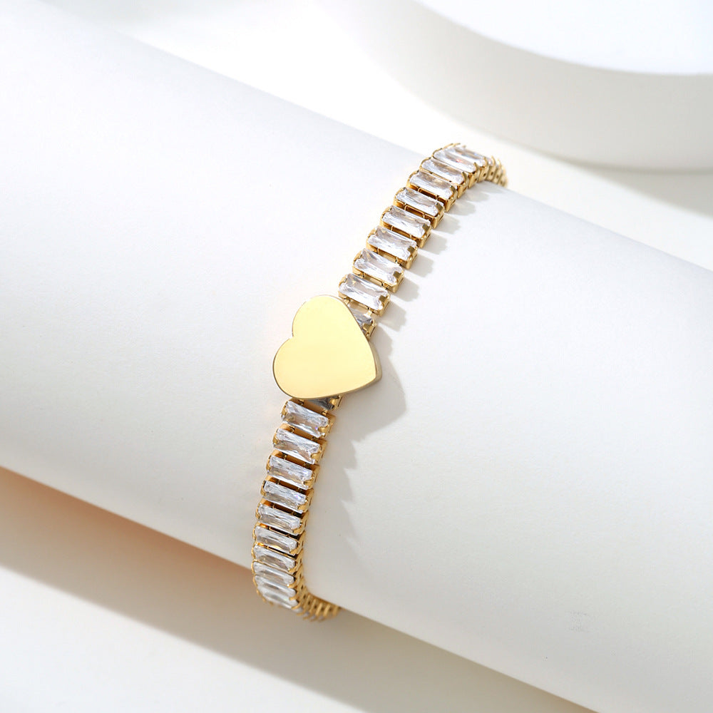Damen Armband mit funkelndem Zirkonia und herzförmigem Anhänger Shop Nory