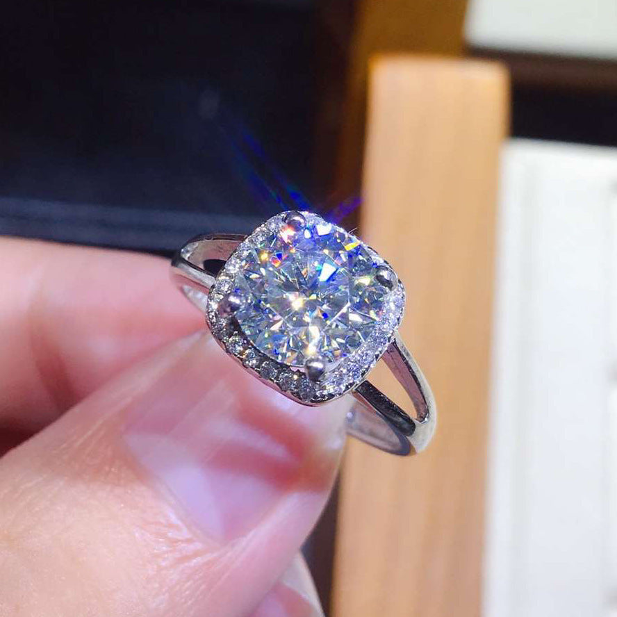 Damen eleganter Schmuckring mit quadratischem Hauptstein und funkelndem Zirkonia-Rahmen Shop Nory