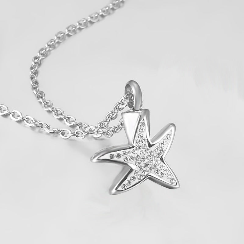 Damen Schmuckanhänger in Form eines Seesterns mit funkelnden Zirkonia Shop Nory