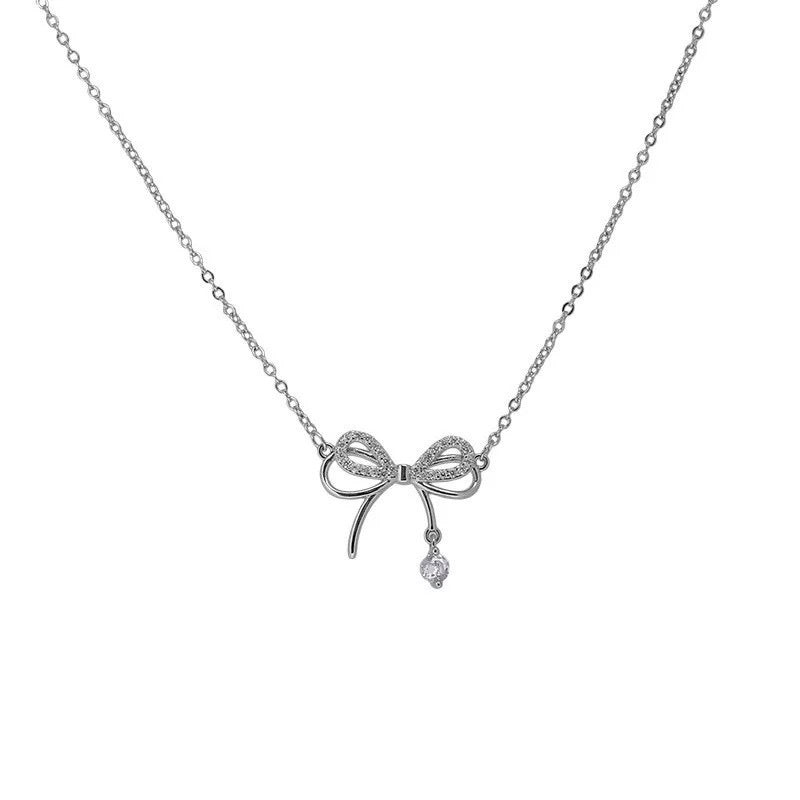 Damen Halskette mit filigranem Schleifenanhänger und funkelnden Zirkonia Shop Nory