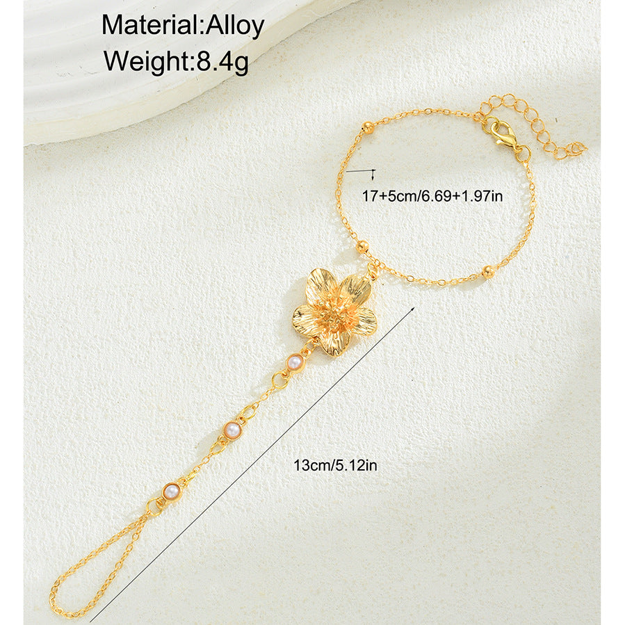 Damen Armreif mit floralen Details und elegantem Perlenakzent Shop Nory
