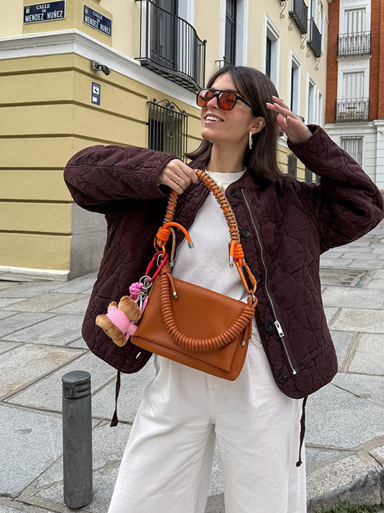 Damen Schultertasche aus Kunstleder mit geflochtenem Henkel und spiralförmigem Vordergriff Shop Nory