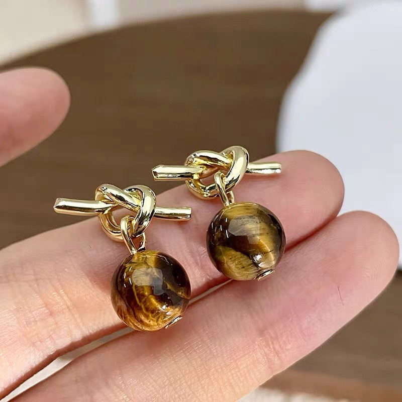 Damen Ohrringe mit einzigartigem Knoten-Design und kunstvollen Kugeln Shop Nory