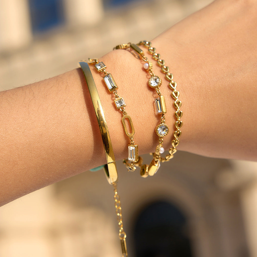 Damen Armband mit funkelnden Kristallen und verstellbarem Edelstahl-Design Shop Nory