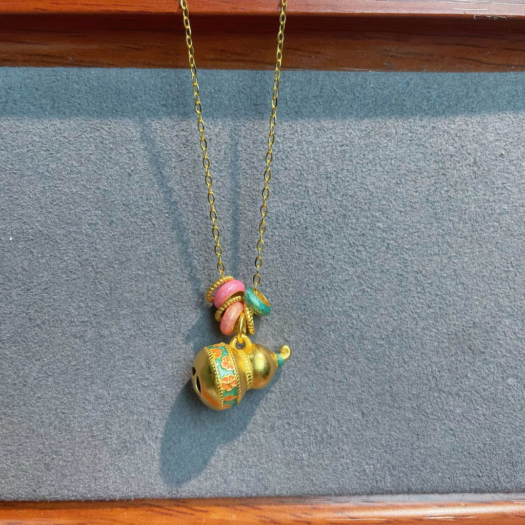 Damen auffällige Halskette mit kunstvollem Glöckchen-Anhänger und bunten Akzenten Shop Nory