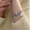 Damenarmband mit kunstvollem Anhänger und edlen Details Shop Nory