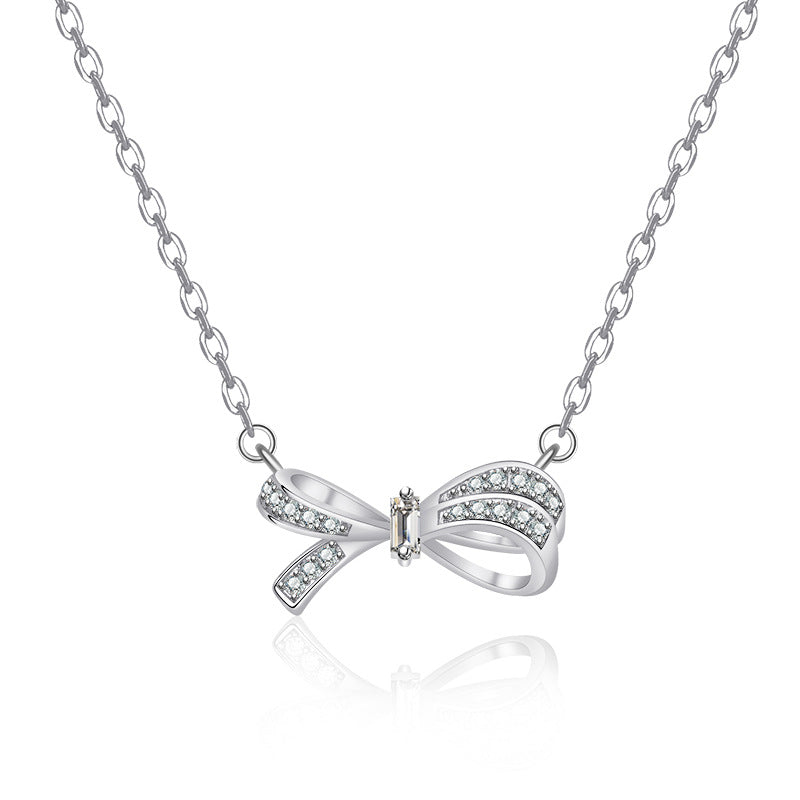 Damen Halskette mit funkelndem Schleifenanhänger aus hochwertigem Edelstahl Shop Nory