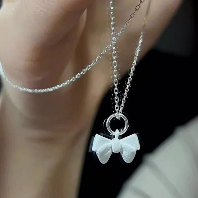 Damen Halskette mit filigranem Schleifenanhänger Shop Nory