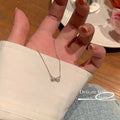 Damen Halskette mit zartem Schleifenanhänger und funkelnden Zirkonia Shop Nory