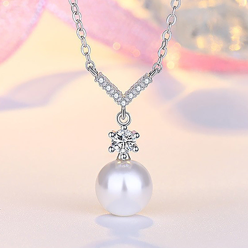 Damen Halskette mit funkelndem Zirkonia-Anhänger und eleganter Perle Shop Nory