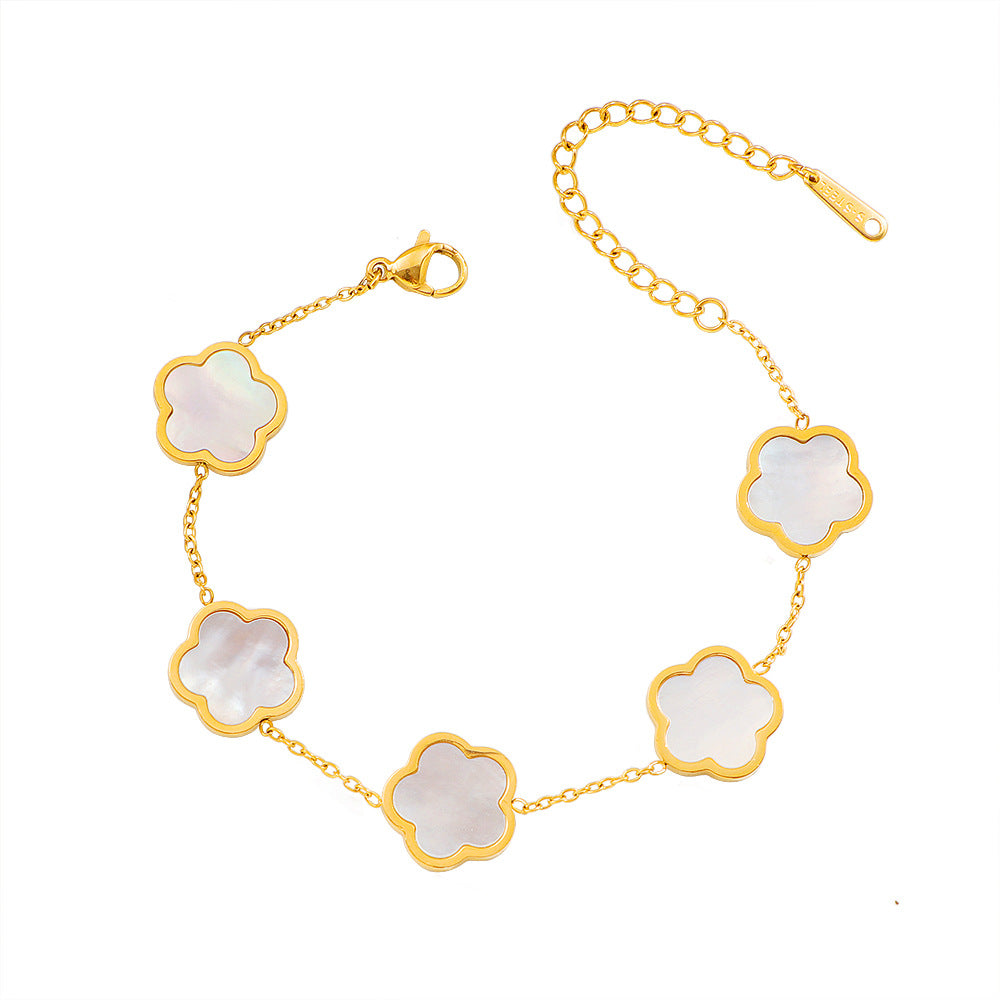 Damen zarte Armbanduhr mit floralem Design und hochwertigen Perlmutt-Elementen Shop Nory