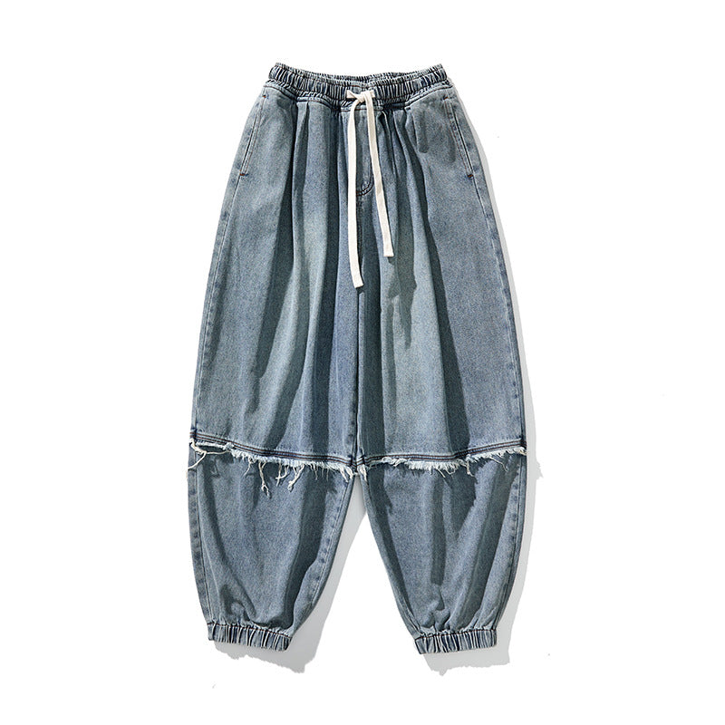 Herren Weit geschnittene Baggy-Denim-Hose mit Tunnelzug, elastischen Beinabschlüssen und Fransen-Detail Shop Nory