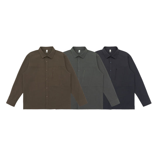 Unisex Oversize-Hemdjacke im Utility‑Style mit verdeckter Druckknopfleiste und diagonaler Reißverschlusstasche Shop Nory