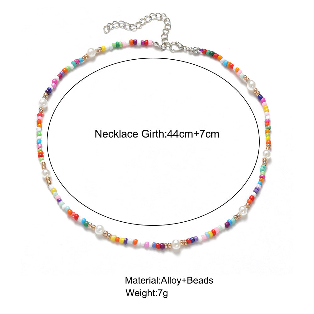 Damen Halskette mit bunten Blumenelementen und eleganten Perlen Shop Nory
