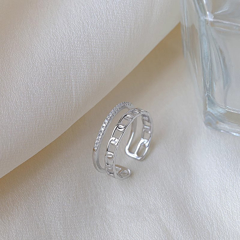 Damen Offener Ring mit funkelndem Zirkonia und modernem Kettendesign Shop Nory