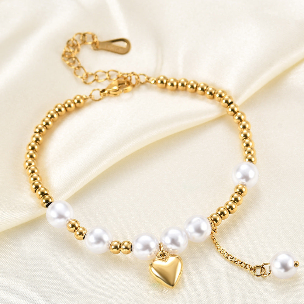 Damen Armband mit Herzanhänger und Perlenakzenten Shop Nory