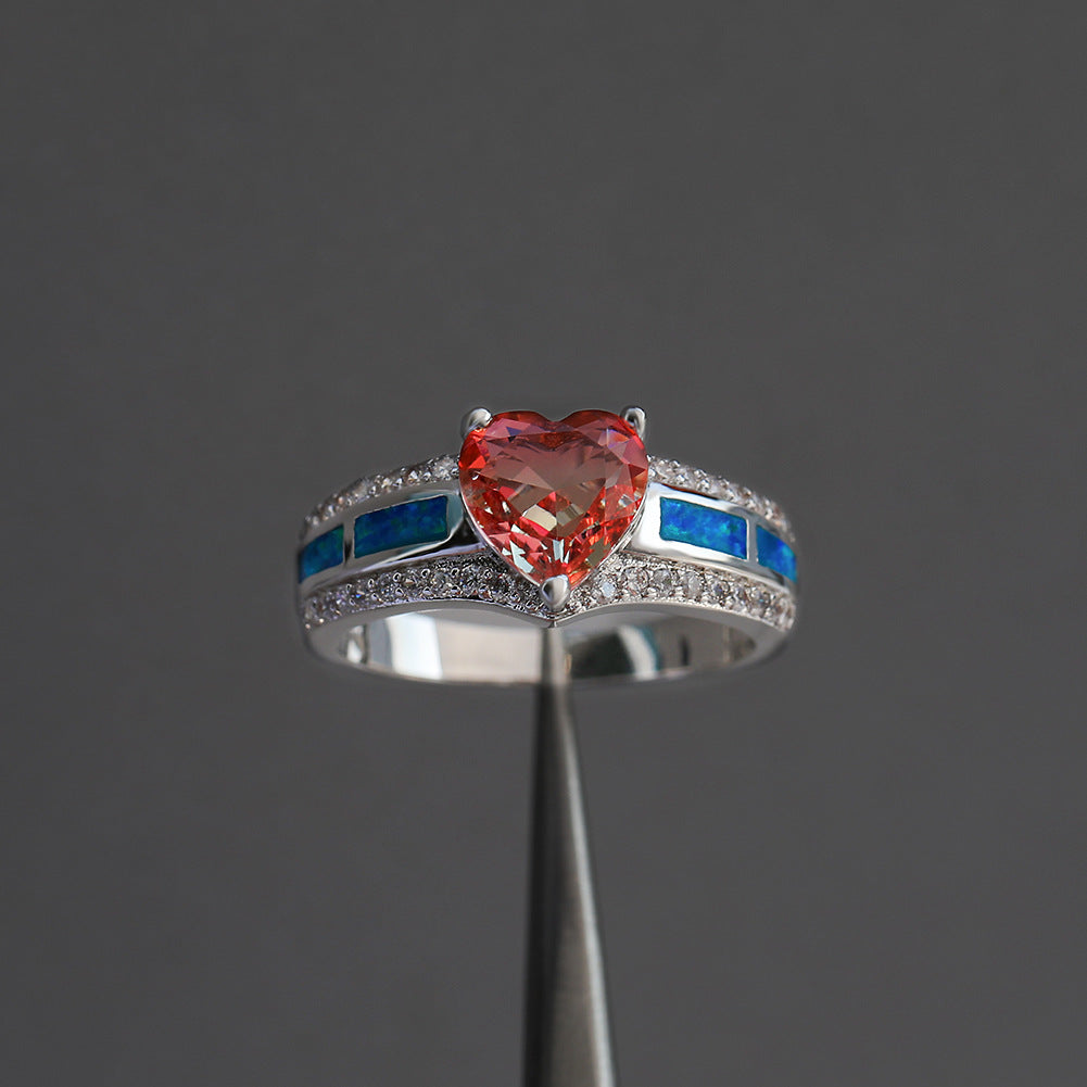 Damen Ring mit herzförmigem smaragdgrünem Stein und feinen Zirkonia-Details Shop Nory
