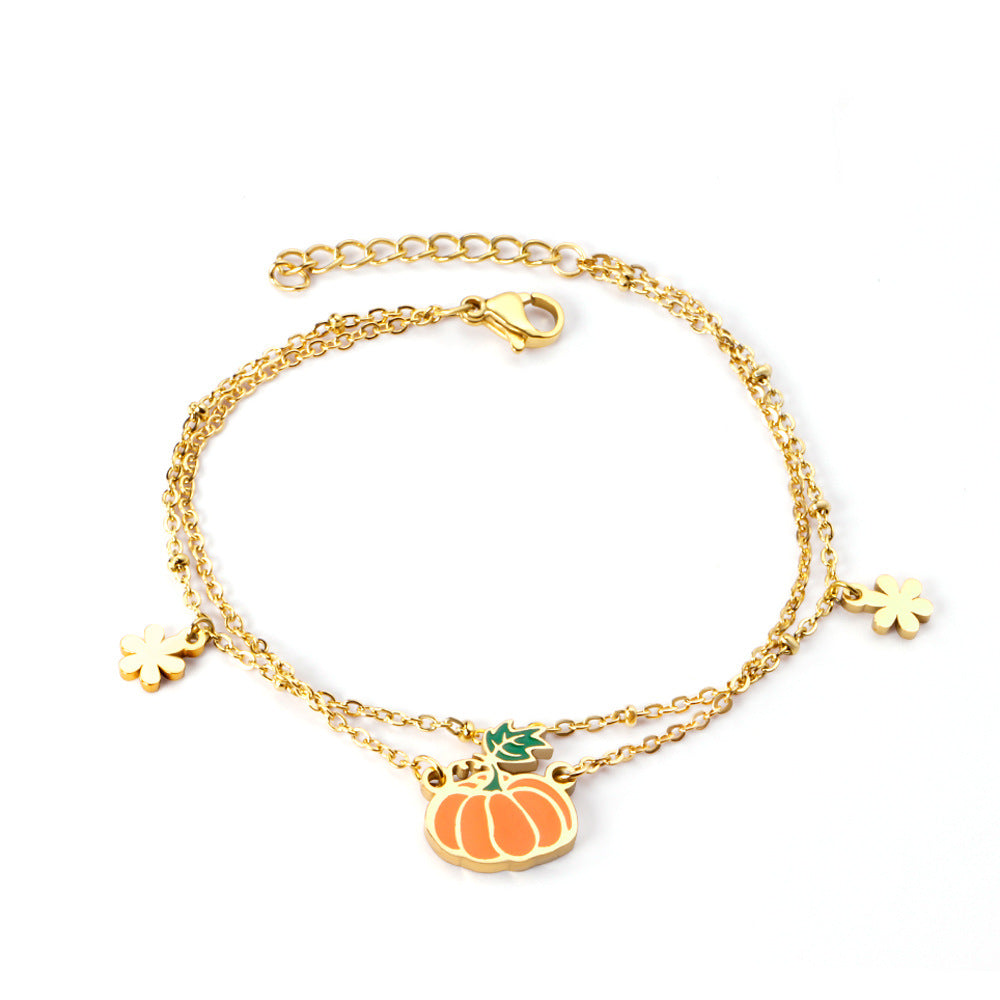 Damen Armband mit verspieltem Hotdog-Anhänger und goldfarbener Kettenstruktur Shop Nory