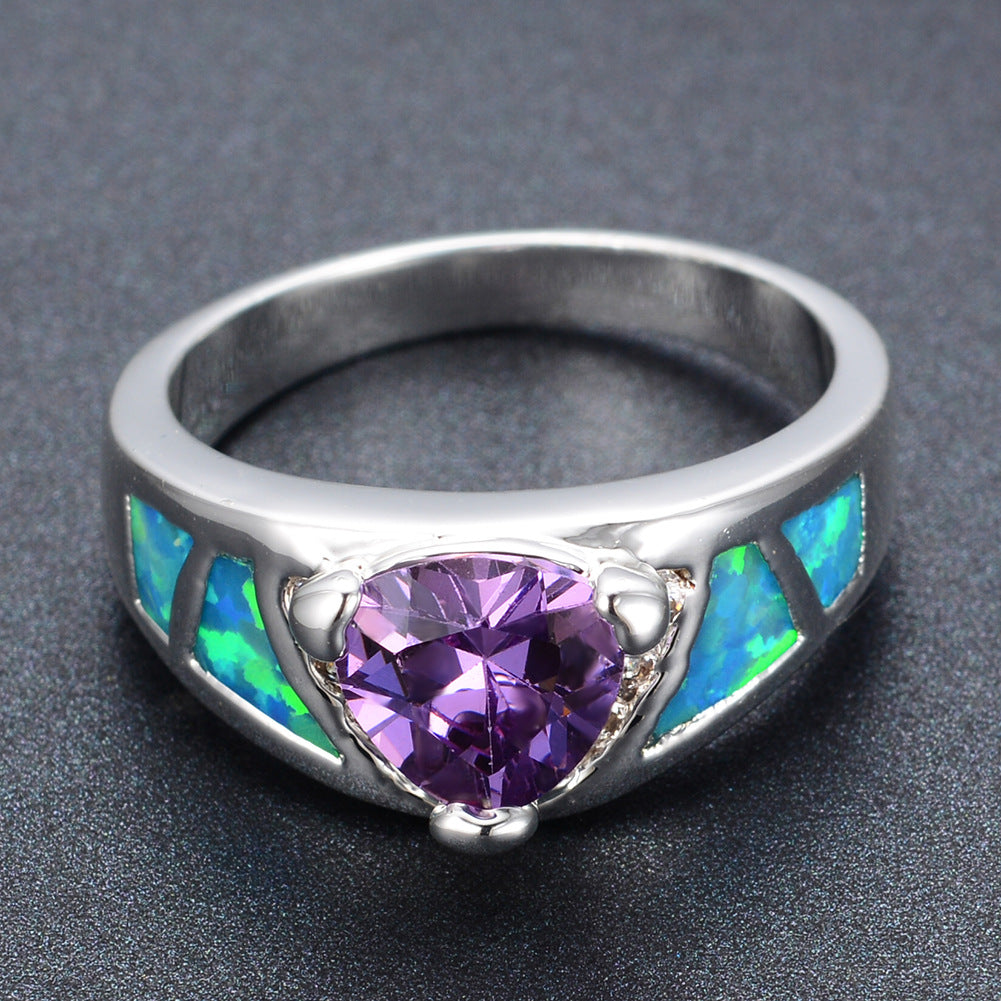Damen Ring mit facettiertem Amethyst und opalisierenden Elementen Shop Nory