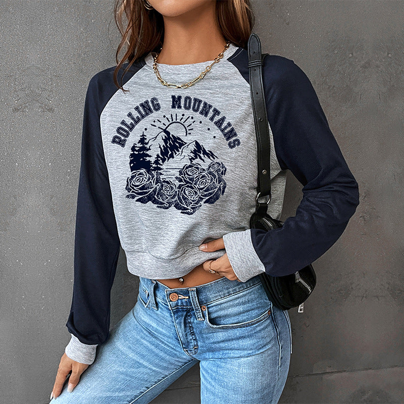 Damen Cropped Raglan-Sweatshirt mit Bergmotiv, Rippbündchen und lockerer Passform Shop Nory