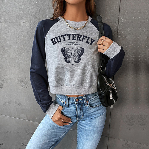 Damen Cropped Raglan-Sweatshirt mit Schmetterling-Print, geripptem Saum und lässiger Passform Shop Nory