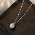Damen elegante Halskette mit zeitlosem Perlenanhänger und feinem Kettendesign Shop Nory