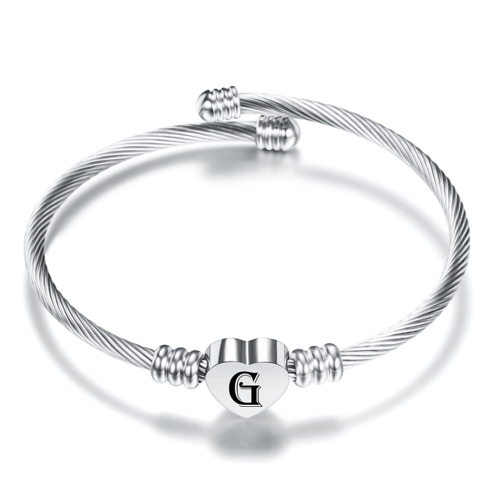 Damen Armreif mit herzförmigem Anhänger und eleganten Akzenten Shop Nory