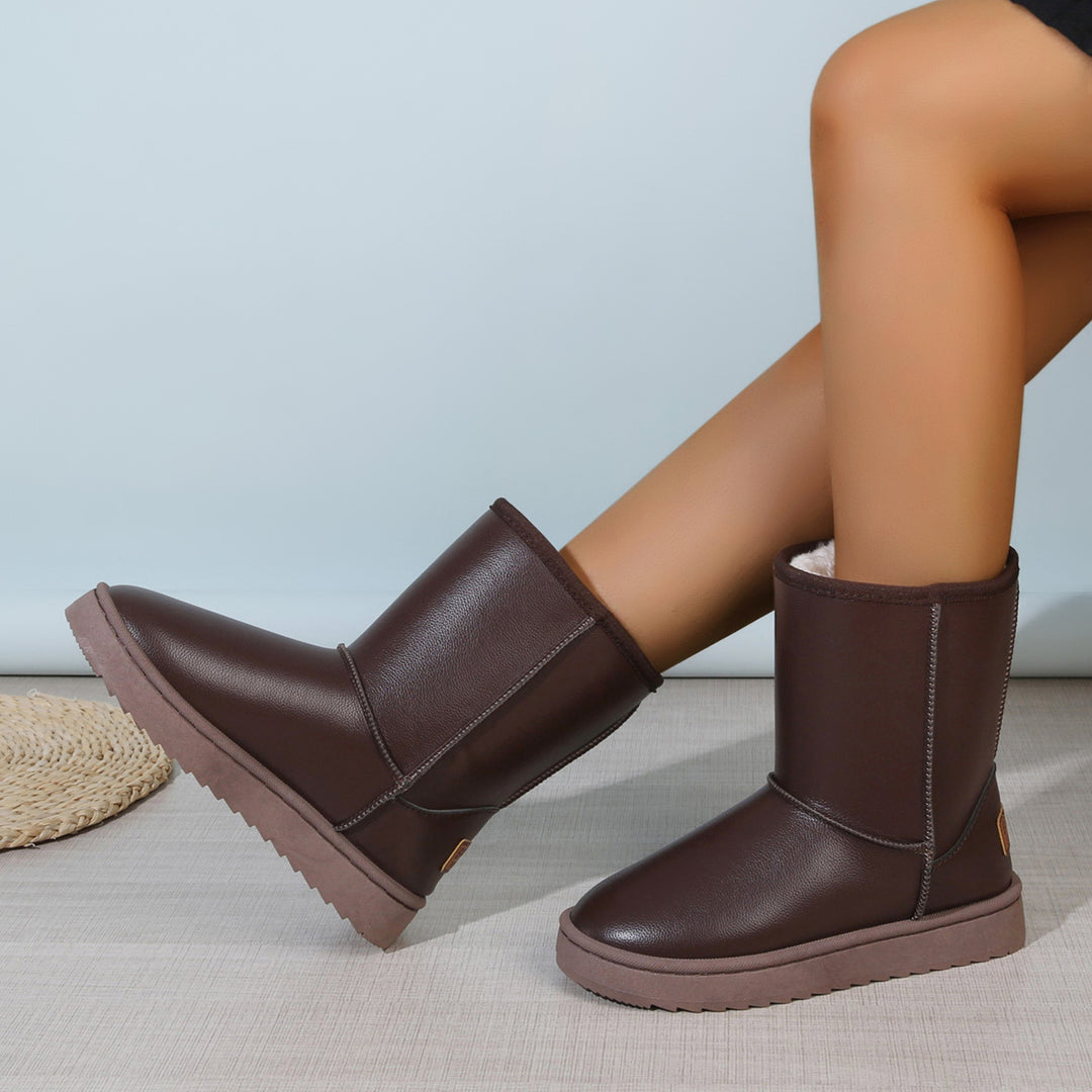 Damen Winterstiefel mit Teddyfutter, Lederoptik und flacher Plateau‑Sohle Shop Nory