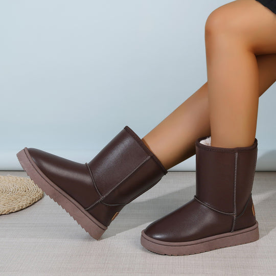 Damen Winterstiefel mit Teddyfutter, Lederoptik und flacher Plateau‑Sohle Shop Nory