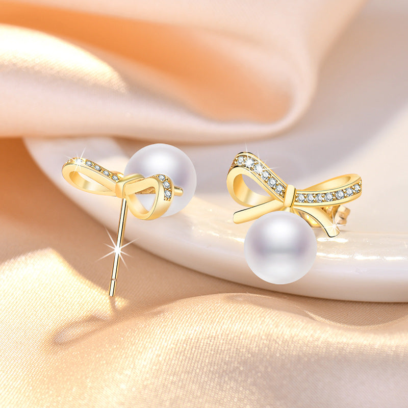 Damen Ohrringe mit Perlendesign und funkelnden Zirkonia Shop Nory