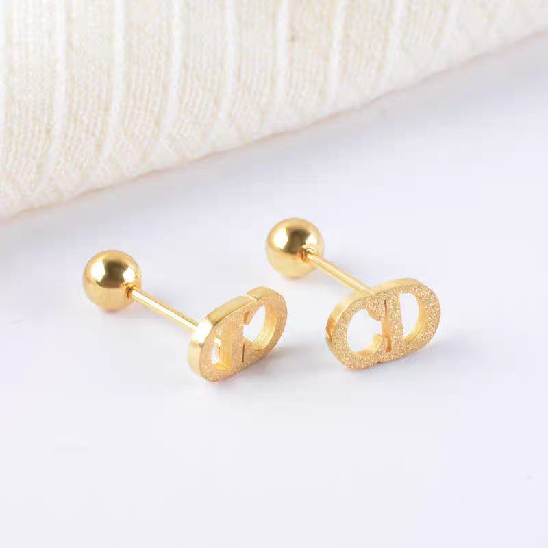 Damen elegante goldene Logo Steckerohrringe Shop Nory
