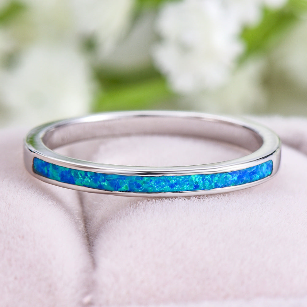 Damen Ring mit schimmerndem Opal und eleganter Edelstahlfassung Shop Nory