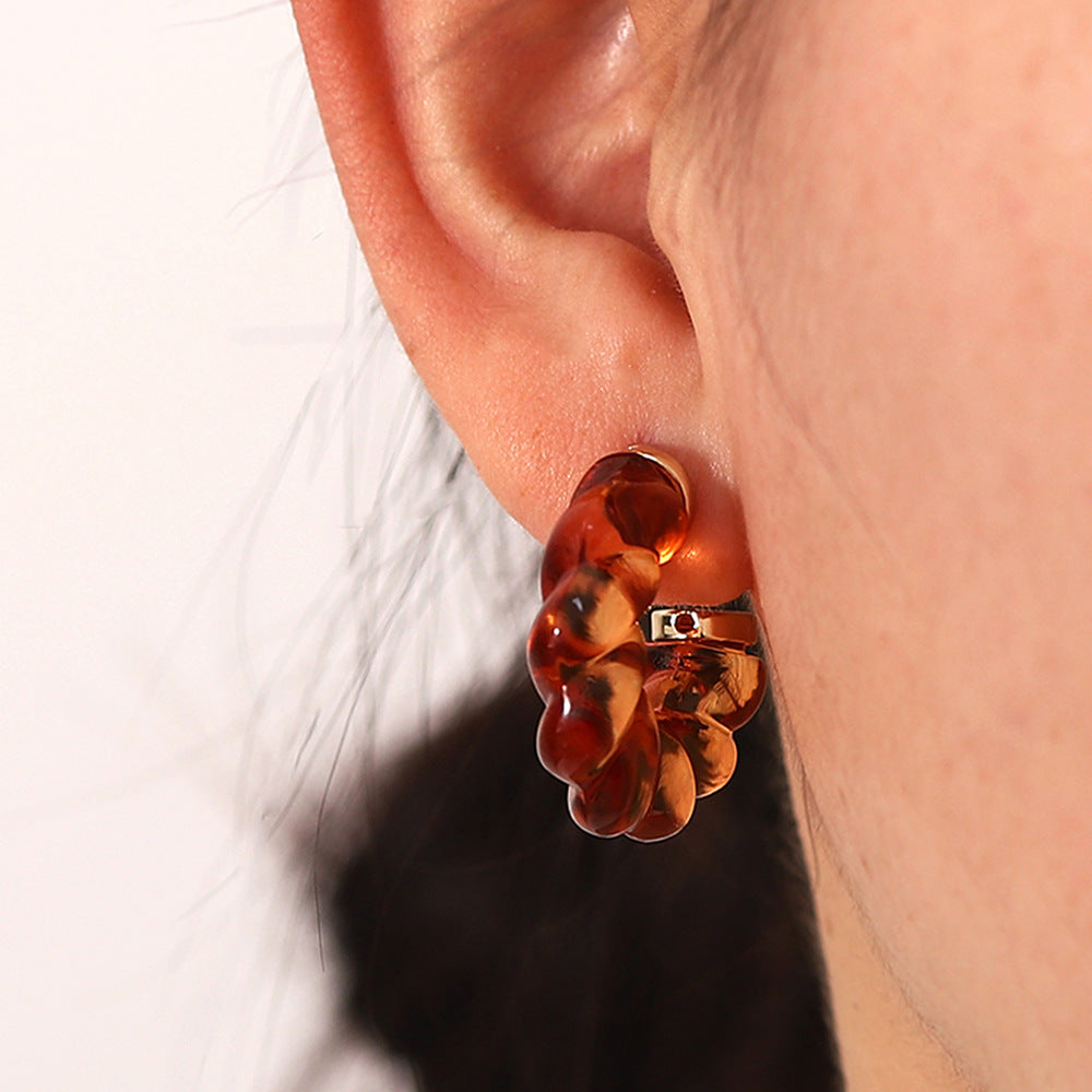 Damen Creolen aus leuchtendem Kunstharz mit elegantem Twist-Design Shop Nory