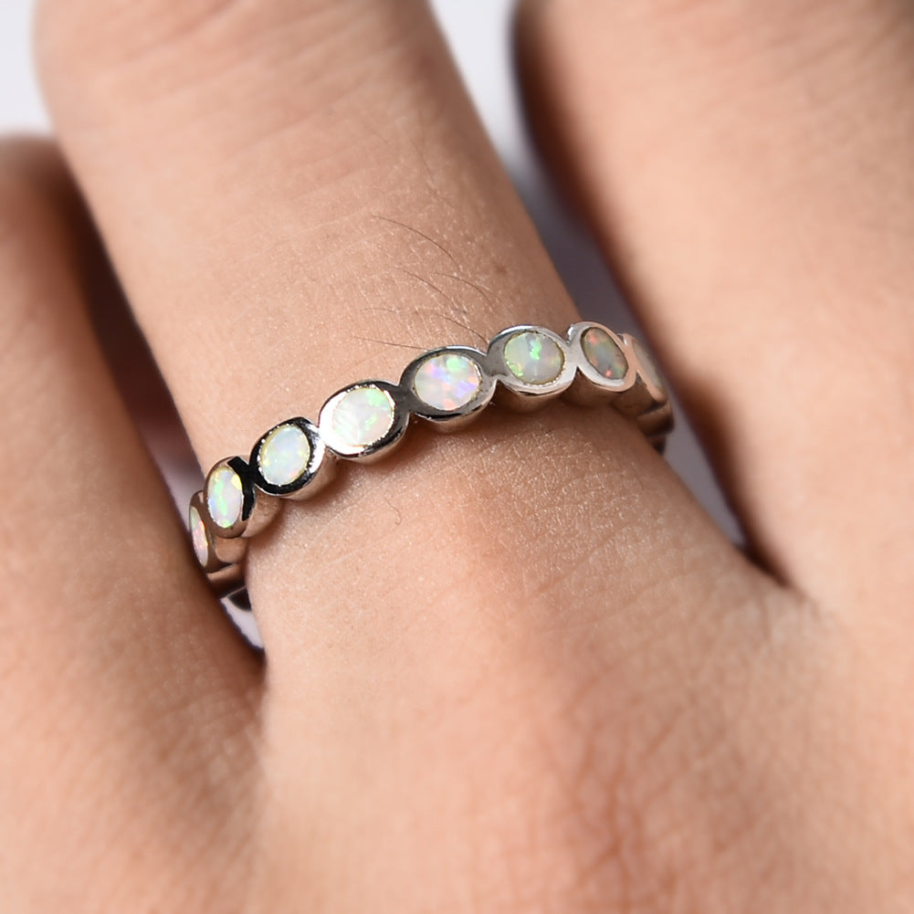 Damen Ring mit schillernden Opalsteinen und eleganter Edelstahlfassung Shop Nory