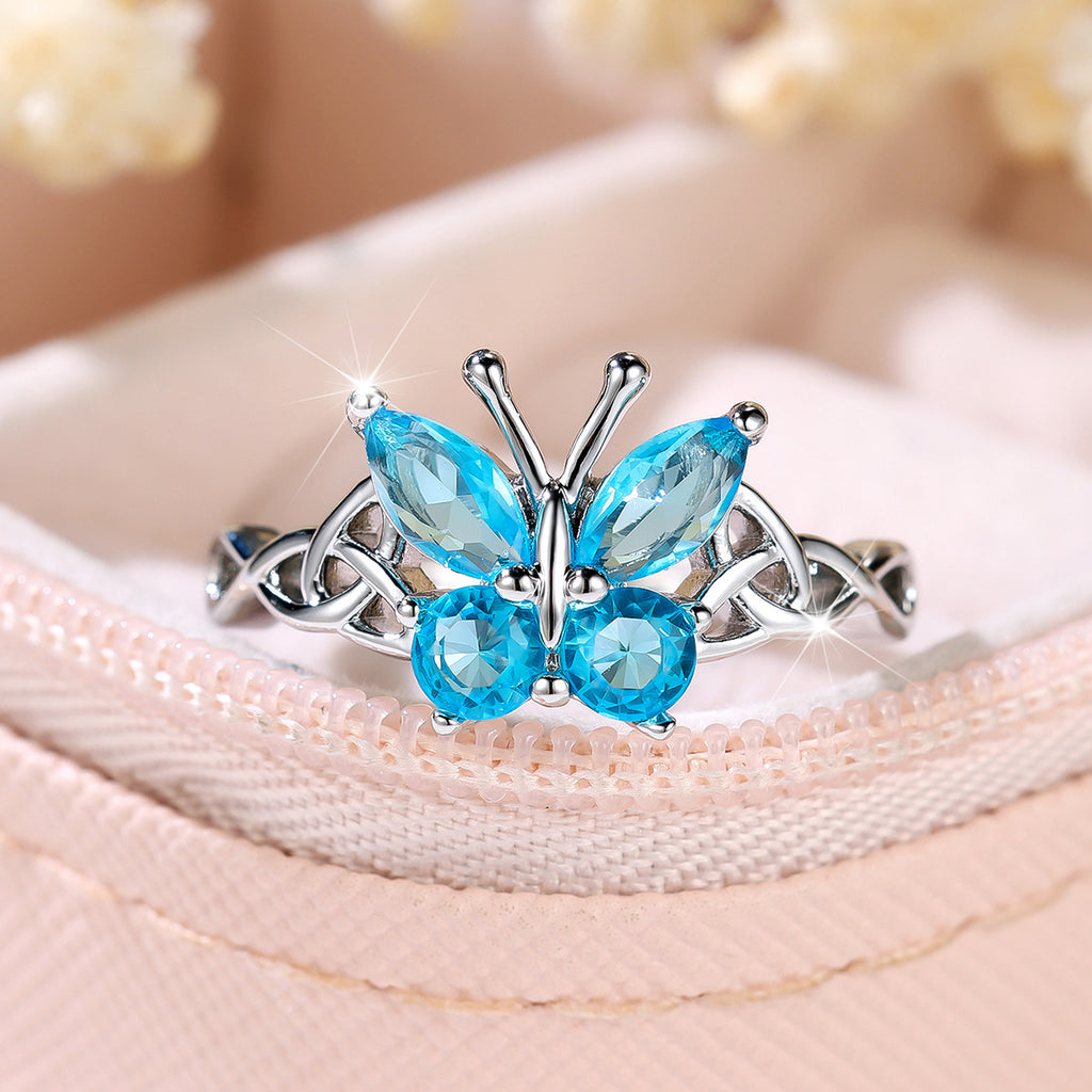 Damen Ring mit kunstvollem Schmetterlingsdesign und schimmernden Opal-Elementen Shop Nory