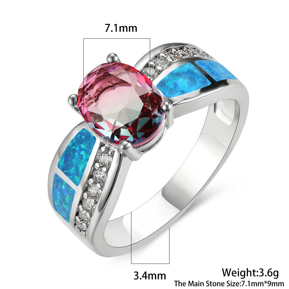 Damen Ring mit kunstvollem Opalanhänger und funkelnden Zirkonia-Details Shop Nory