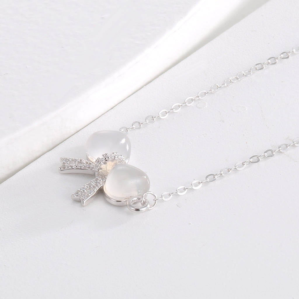 Damen Halskette mit kunstvollem Schleifenanhänger und strahlenden Zirkonia Shop Nory