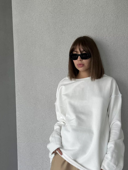 Damen oversized Sweatshirt mit ausgefranstem Saum und verlängerten Ärmeln Shop Nory