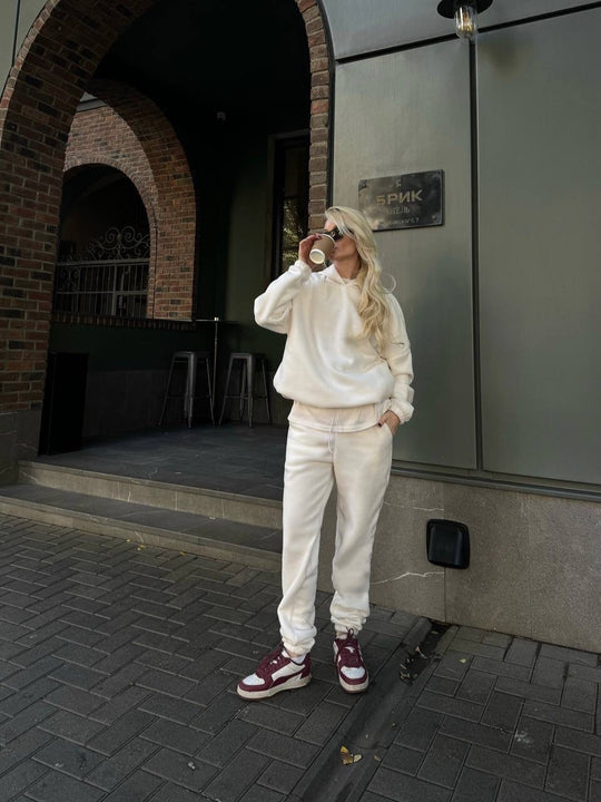 Damen kuscheliges Sweat-Set mit extralangem Kapuzenpullover, verdeckter Kängurutasche und schmal zulaufender Bündchenhose Shop Nory