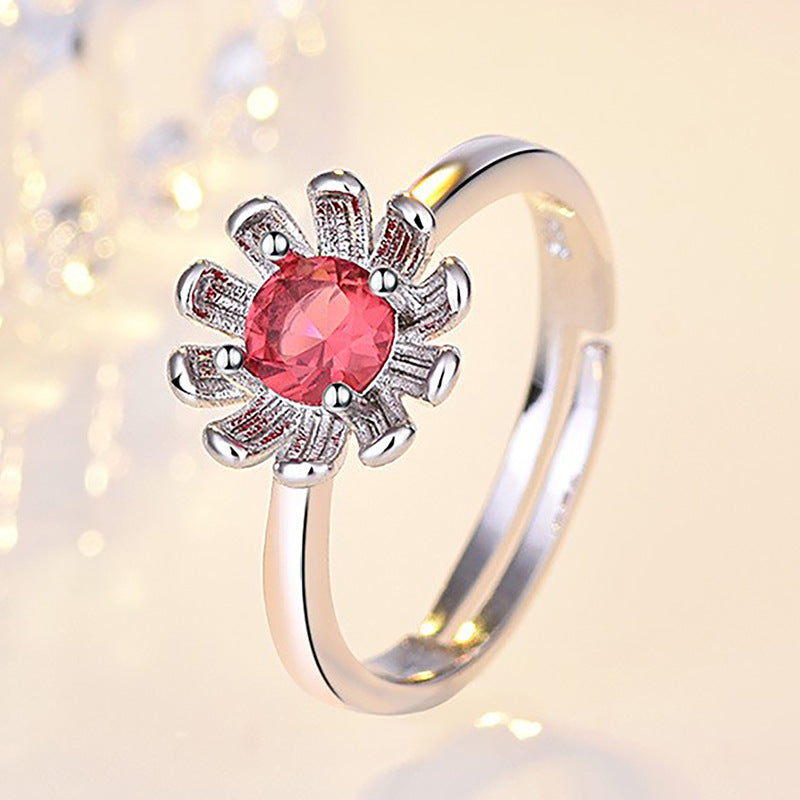 Damenring mit funkelndem rotem Edelstein und floralem Design Shop Nory